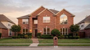 Plano–Frisco area brick home with modern almond-colored energy-efficient replacement windows showing improved curb appeal and comfort