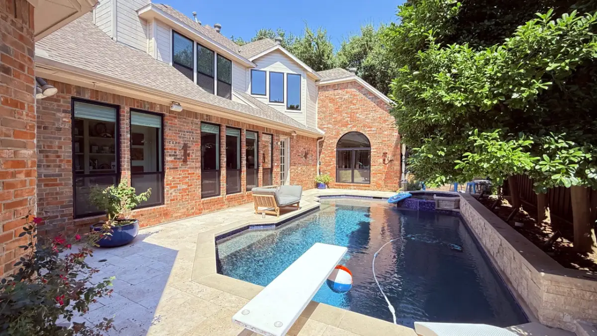 After: new replacement windows on the same brick home, installed by Optimal Windows